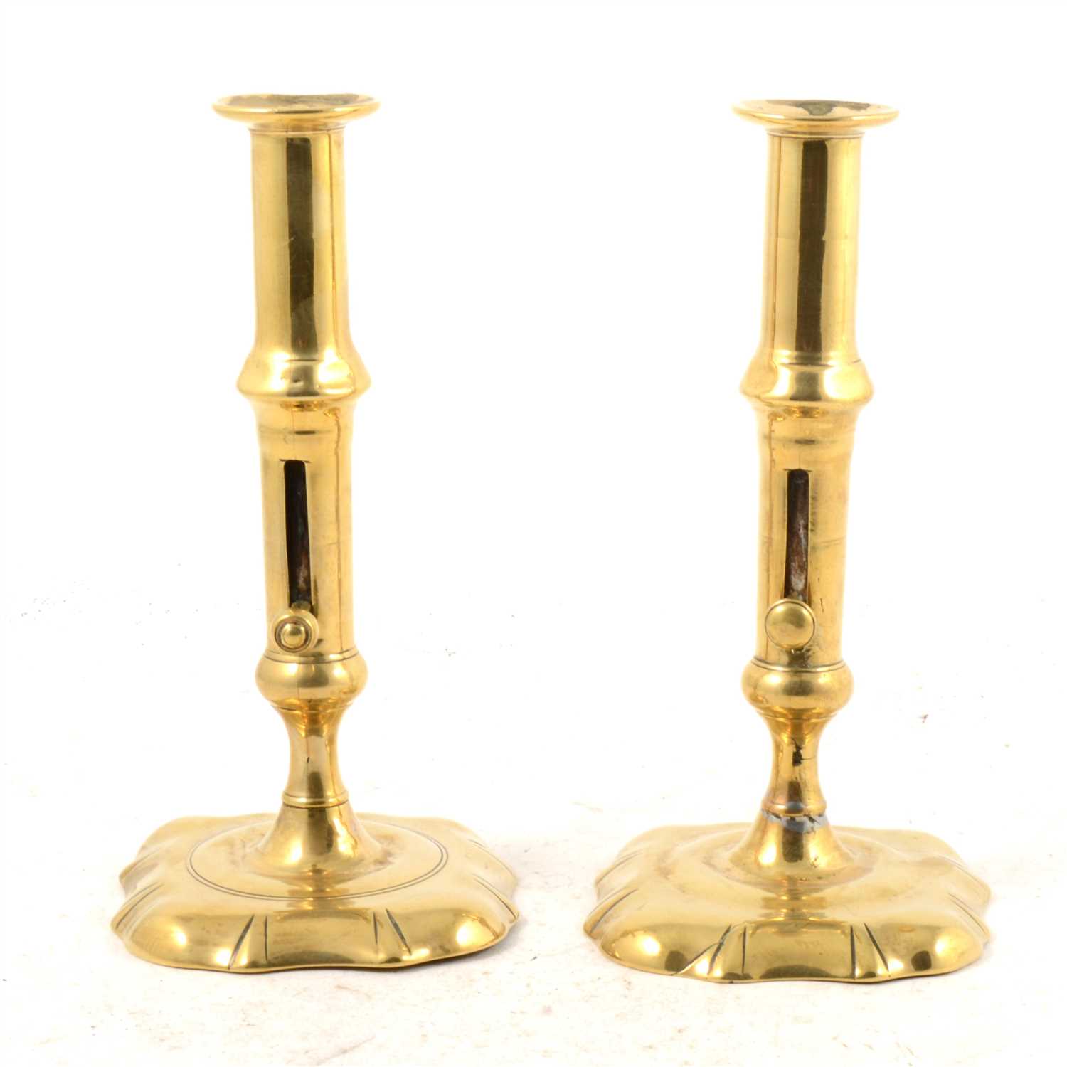 Lot 175 - Pair of George III brass candlesticks with...