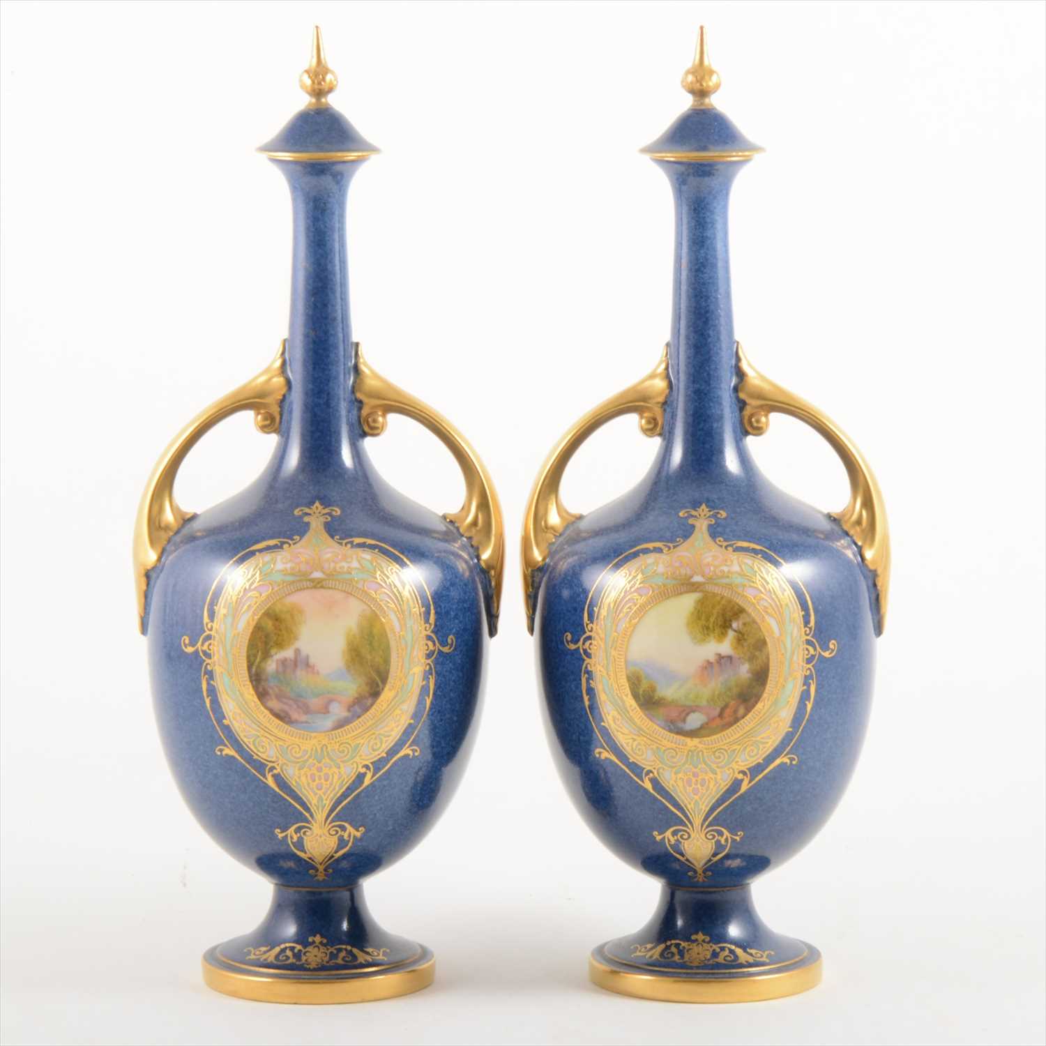Lot 1055 - A pair of Royal Worcester ornamental bottle vases and covers