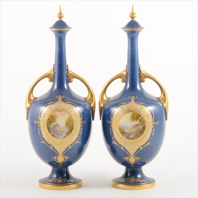 Lot 1055A - A pair of Royal Worcester ornamental bottle vases and covers