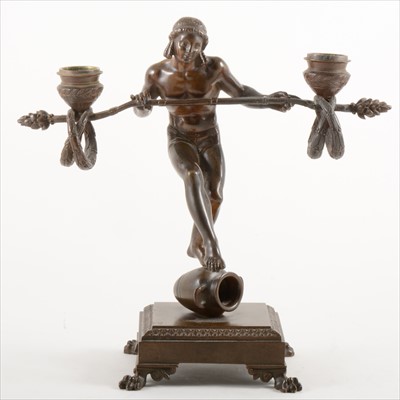 Lot 119 - A bronze figural two-light candelabra
