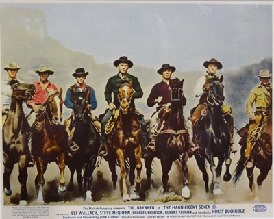 Lot 162 - Cinema lobby card The Magnificent Seven, 20cm by 25cm, framed and glazed.