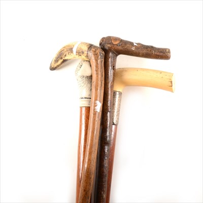 Lot 222 - A Victorian presentation walking stick, ivory handle, silver ferrule, and three others