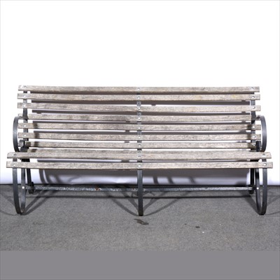 Lot 567 - A slatted wooden garden bench