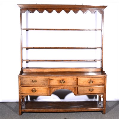 Lot 561 - A joined oak dresser, some alteration, three...