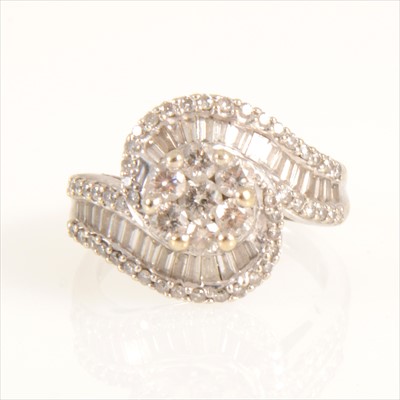 Lot 663 - A diamond crossover cluster ring.