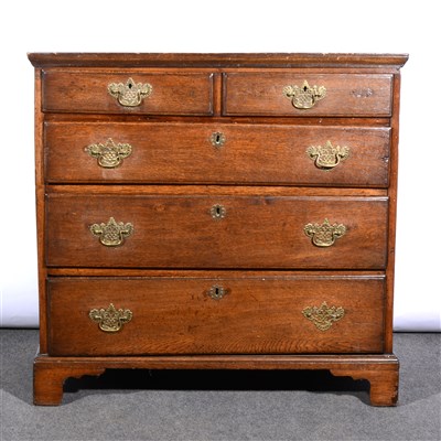 Lot 410 - A Georgian oak chest of drawers