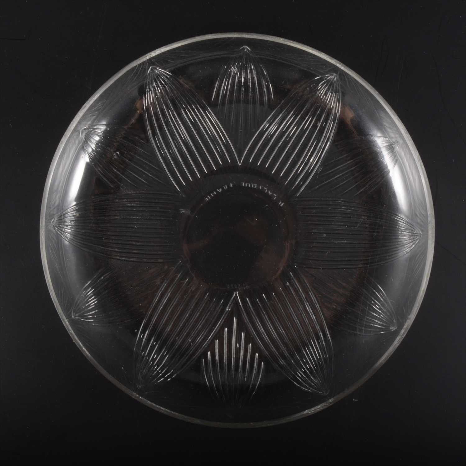Lot 36 - A 'Lotus' design clear glass shallow bowl/ dish, by René Lalique.