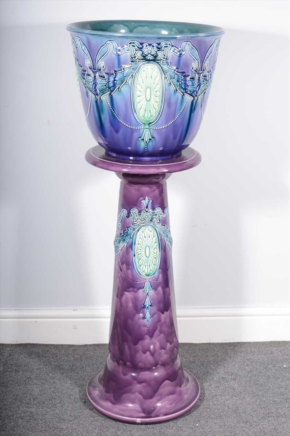 Lot 80 - A Continental pottery jardiniere on stand.