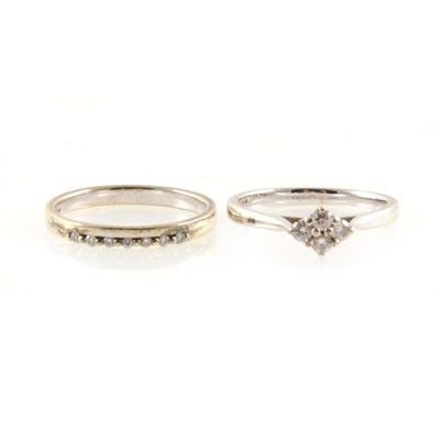 Lot 147 - Two diamond rings designed to be worn together or individually.