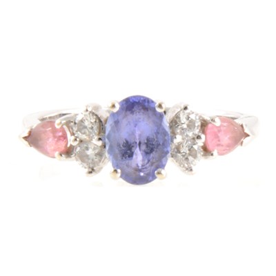 Lot 385 - A tanzanite and diamond ring.