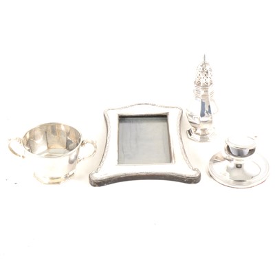 Lot 180 - A silver sugar caster, bowl, capstan inkwell and photograph frame.