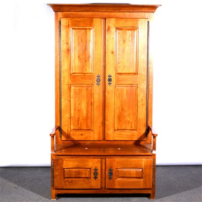 Lot 433 - A reproduction oak hall bench / cupboard, ...