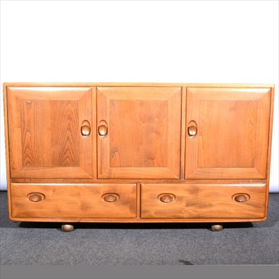 Lot 257 - A light elm sideboard by Ercol.