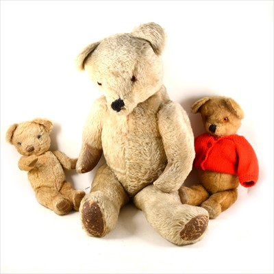 Lot 167 - A large plush teddy bear, 80cm with jointed limbs and two smaller teddy bears.
