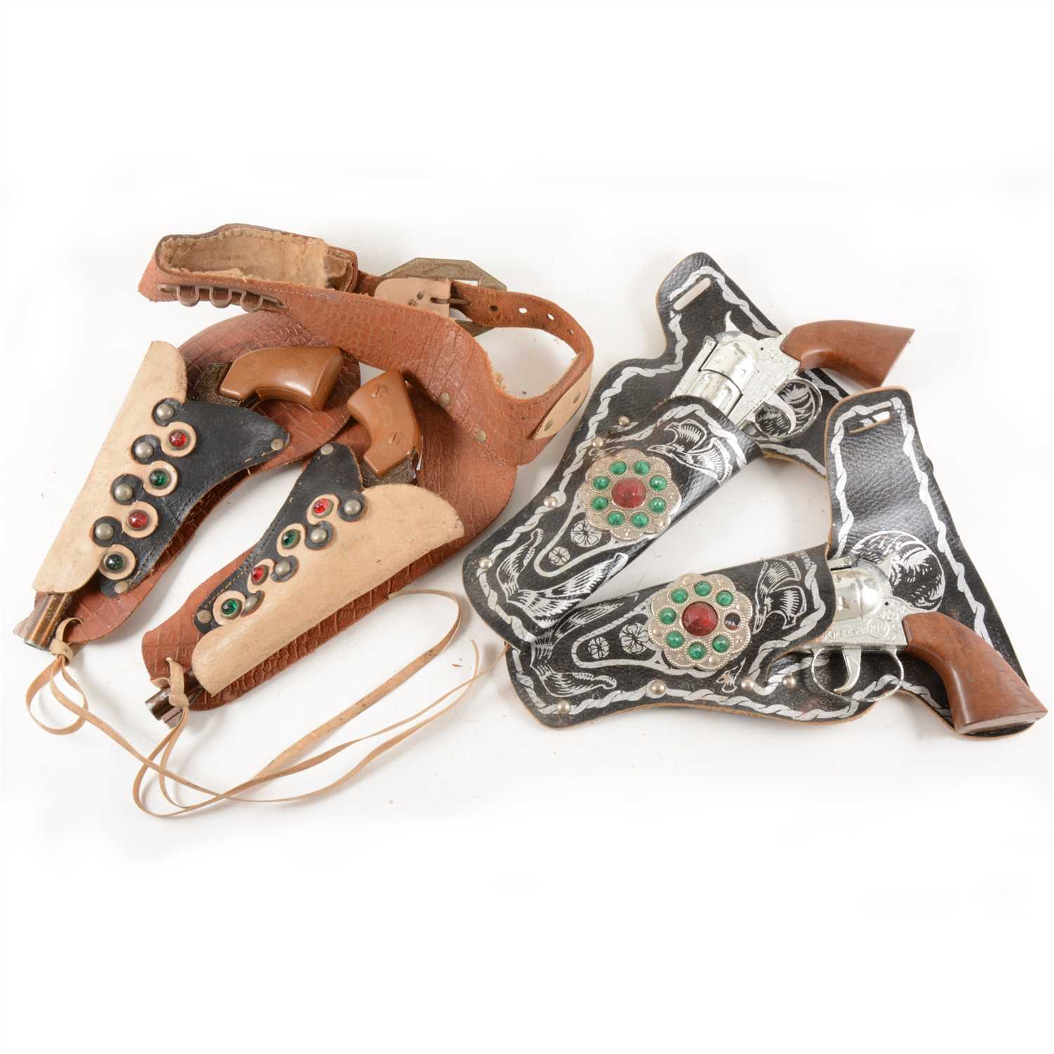 Lot 133 - Two pairs of Lone Star Wild West type revolvers in pouches; including the Super Cowboy, and the Pecos Kid.