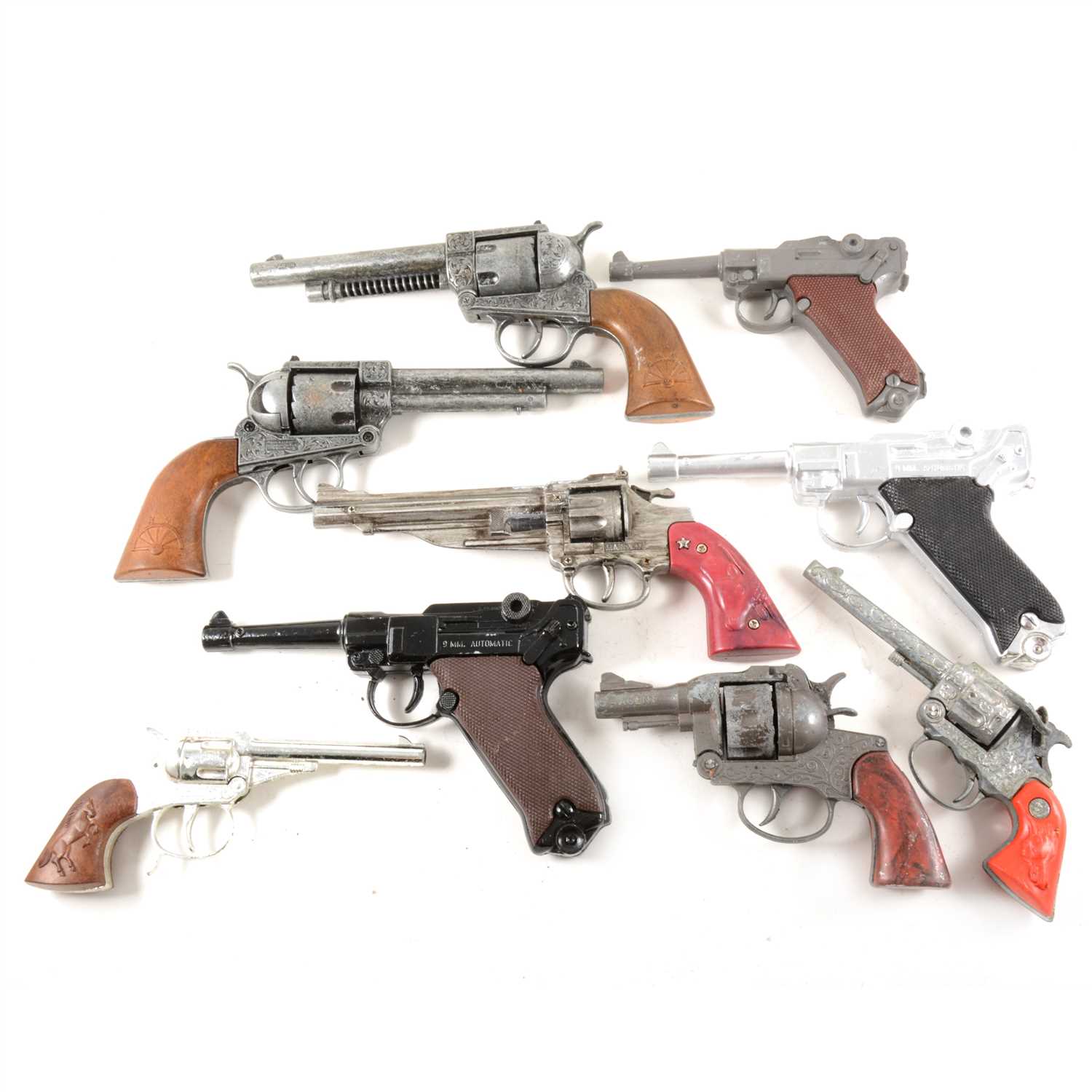 Lot 136 - Vintage toy pistol and revolver type cap guns; a selection to include examples by Lone Star, Edison Giocattoli, and others, nine in total.