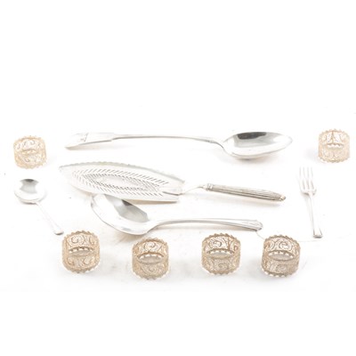 Lot 448 - A Georgian silver fish slice, silver caddy spoon, filigree napkin rings, and other plated flatware.
