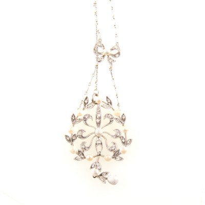 Lot 404 - An Edwardian diamond and seed pearl necklace.