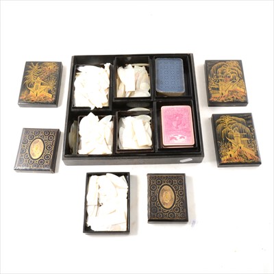 Lot 144 - A collection of Chinese mother of pearl gaming counters, in a black lacquered case