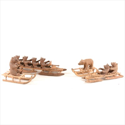 Lot 142 - Four Arosa Black Forest type wooden models, comprising two bobsleigh's and two sledge