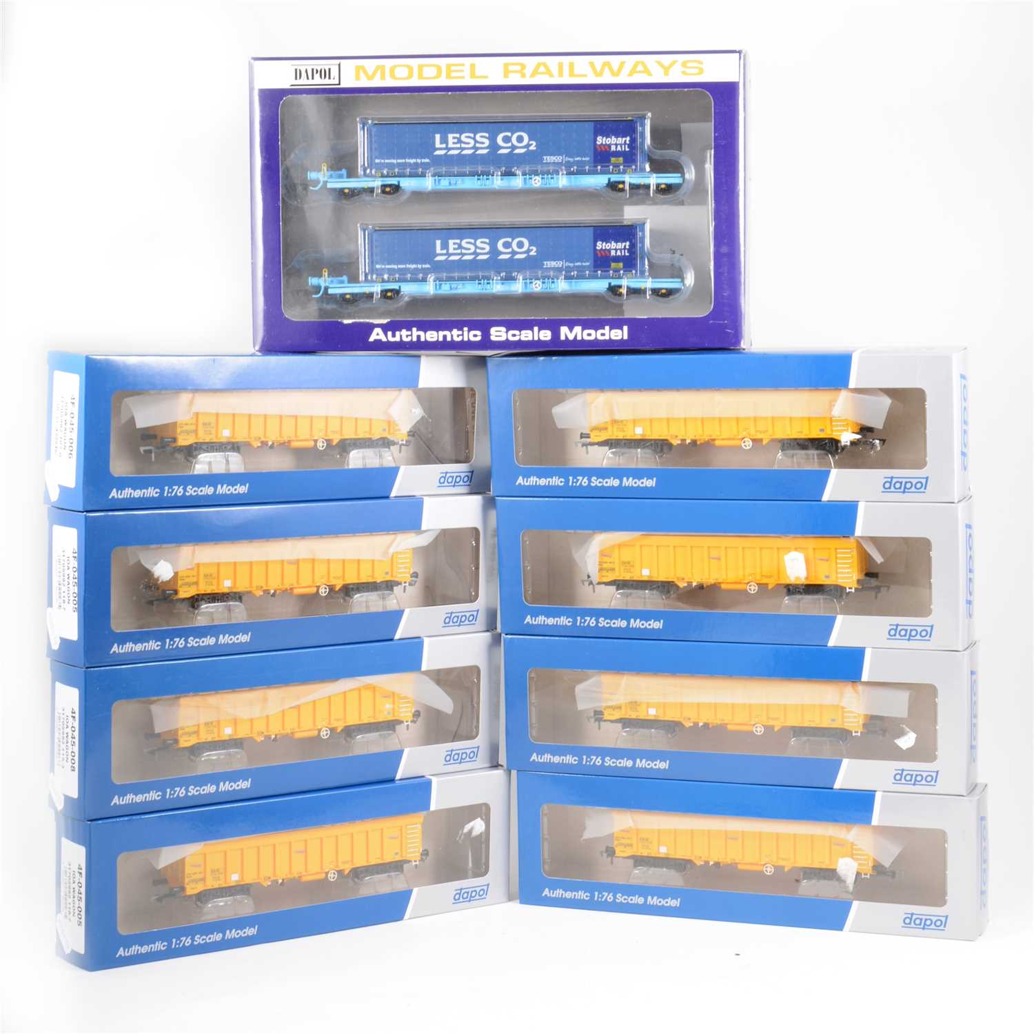Lot 50 - Dapol OO gauge model railways; eight IOA wagons and a Stobart/Tesco container set.