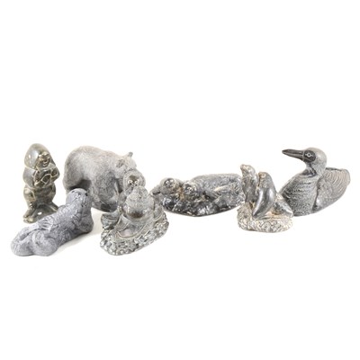 Lot 99 - Thirty Inuit-style carvings and cast resin, one by Levi Smith, others by Wolf and Jonlin, some un-named.