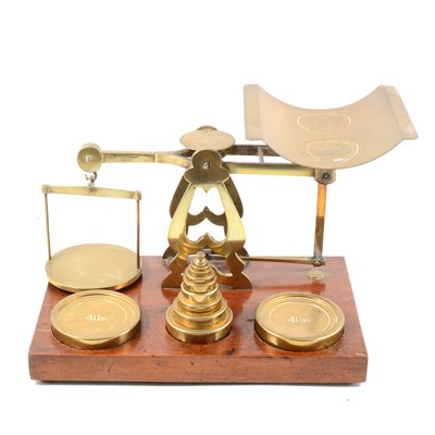 Lot 312 - A set of brass postal balance scales, ...