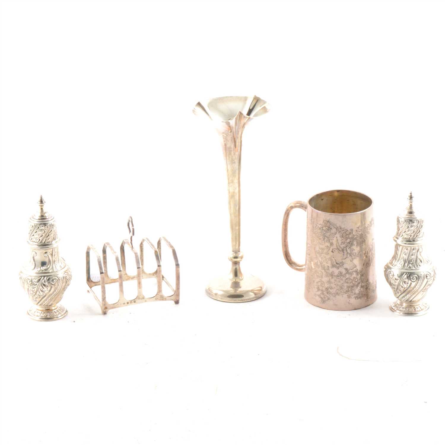 Lot 447 - A pair of Victorian silver sugar casters, christening cup, toast rack and spill vase.