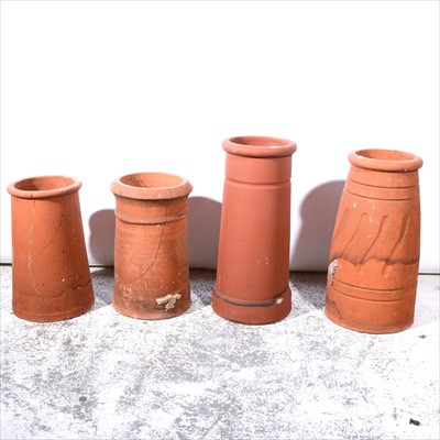 Lot 527 - A collection of four terracotta chimney pots,...