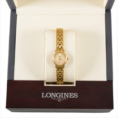 Lot 730 - Longines - a lady's gold-plated bracelet watch.