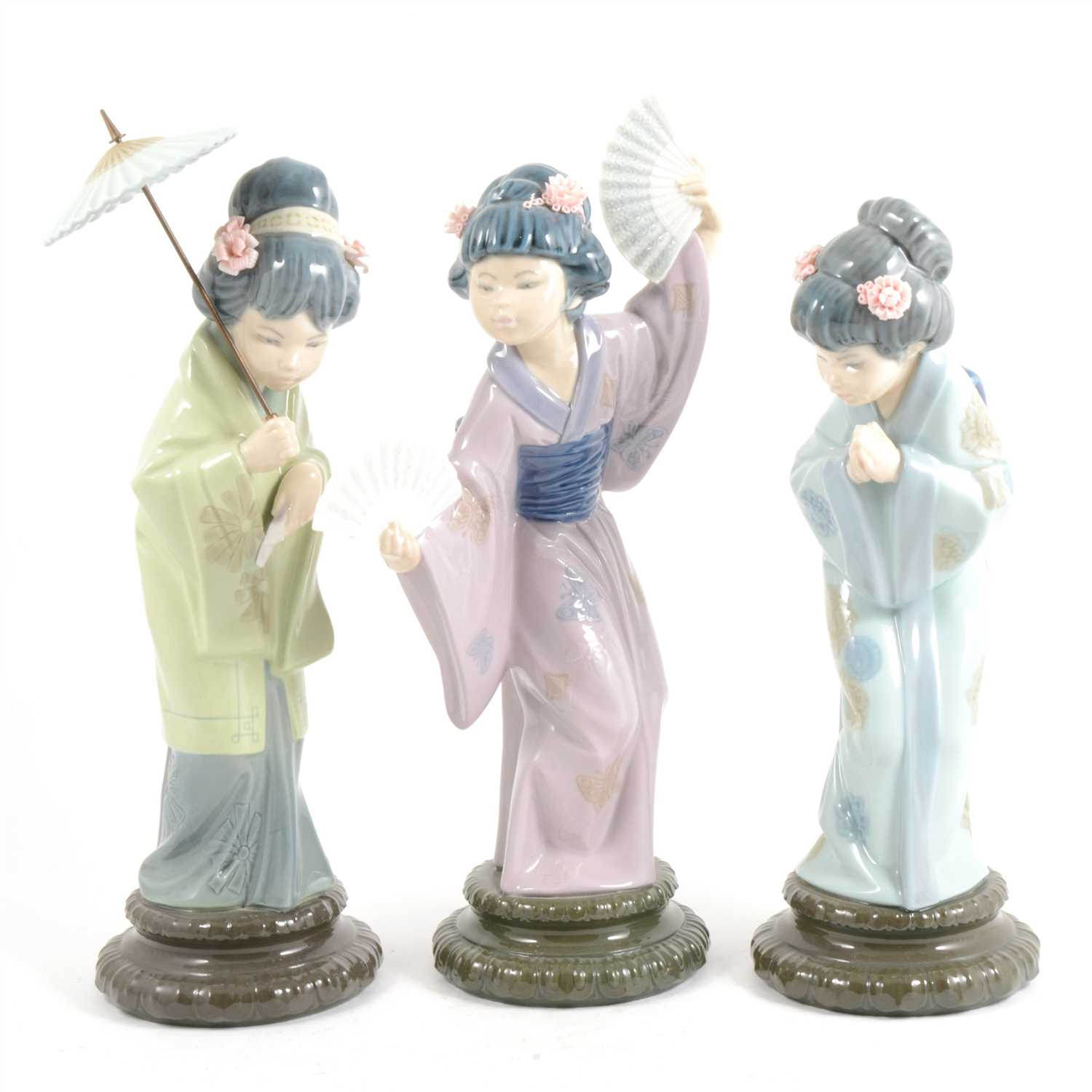 Lot 4 - Three Lladro figures of Japanese girls, ...