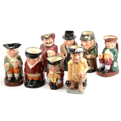 Lot 45 - A collection of eight Royal Doulton Toby jugs, including Winston Churchill, ...