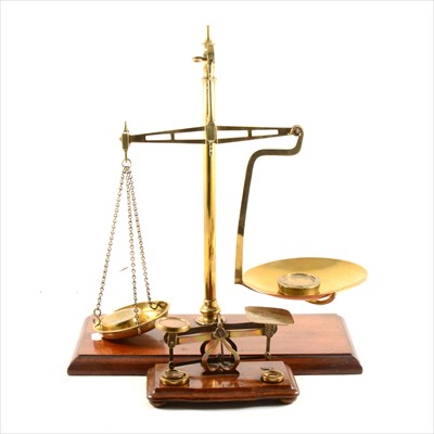 Lot 215 - A set of brass balance scales, and a set of postal scales