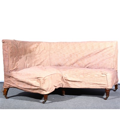 Lot 540 - A Victorian walnut corner sofa, with old loose covers, ...