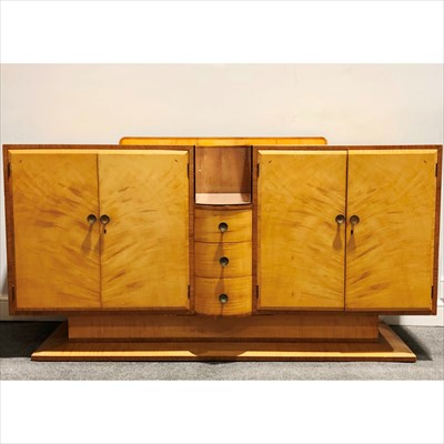 Lot 127 - An Art Deco satin wood dining room suite.