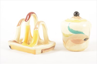 Lot 155 - A pottery toast rack and small preserve jar, by Susie Cooper, circa 1930.