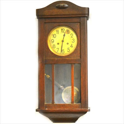 Lot 307 - A stained oak wall clock