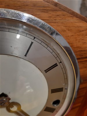 Lot 139 - An Art Deco style mantel clock and a small barometer.