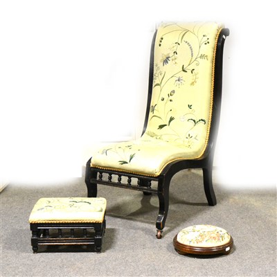 Lot 507 - A Victorian nursing chair, ebonised footstool; and another