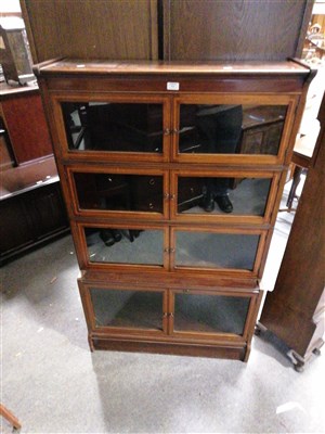 Lot 576 - An Edwardian inlaid mahogany four-height sectional bookcase, ...