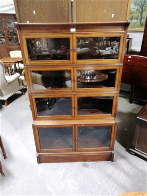 Lot 575 - An Edwardian inlaid mahogany four-height sectional bookcase, ...