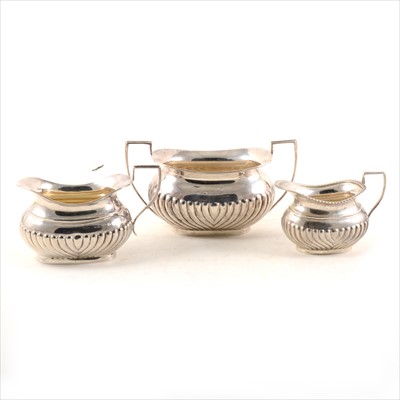 Lot 400 - A silver sugar bowl, Mappin & Webb, Sheffield 1893, and two similar milk jugs.