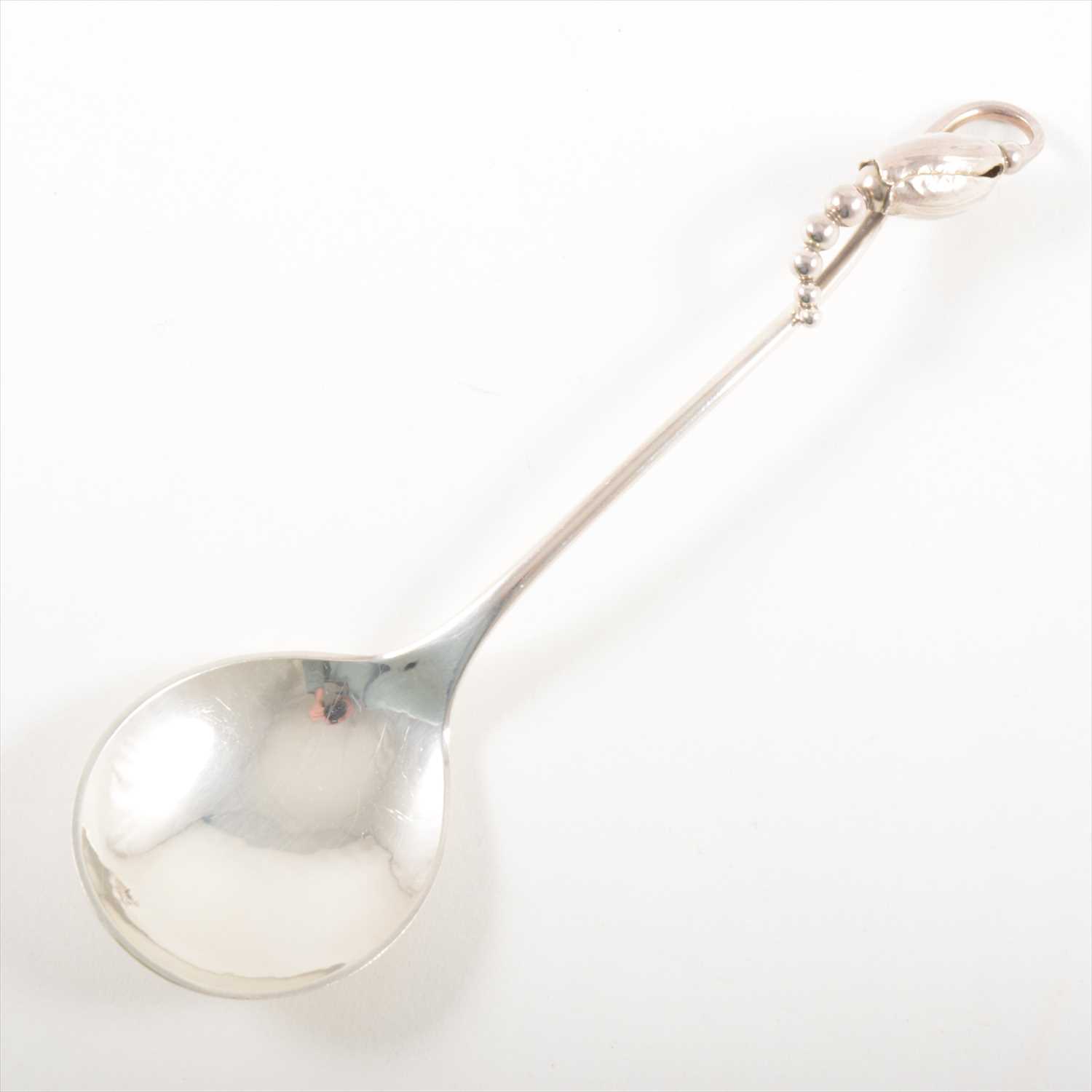 Lot 188 - A sterling silver preserve spoon, Georg Jensen, post-1945.