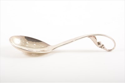 Lot 187 - A sterling silver pierced  serving spoon, Georg Jensen, post-1945.
