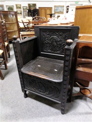 Lot 650 - A dark oak "Monks Seat"