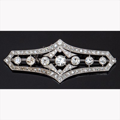 Lot 647 - An early 20th Century diamond set bar design brooch.