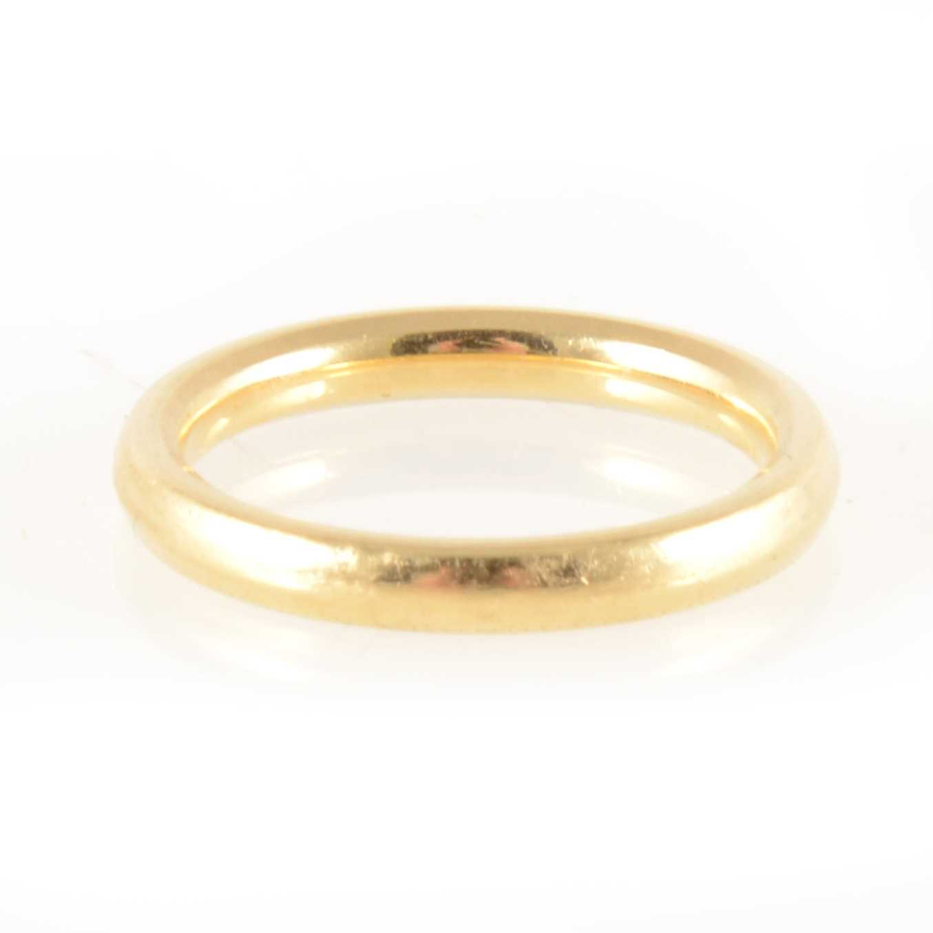 Lot 234 - An 18 carat yellow gold wedding band.