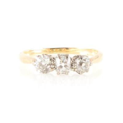 Lot 192 - A diamond three stone ring.