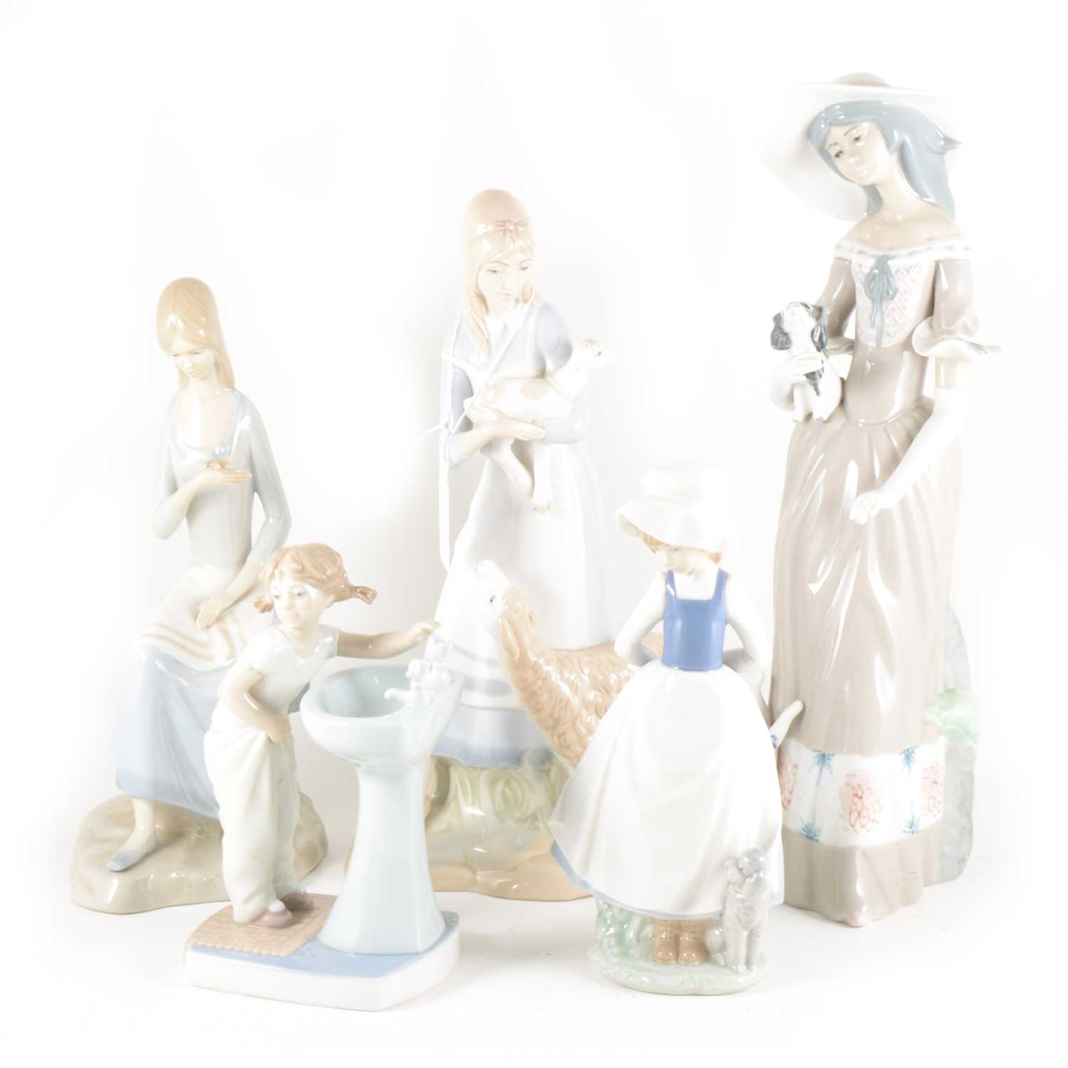 Lot 28 - Ten assorted Spanish porcelain figures, including Lladro and Nao.