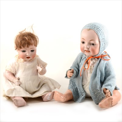 Lot 117 - Two German bisque head baby boy dolls, one with 99/7 head stamp, both with fixed eyes and open mouths.